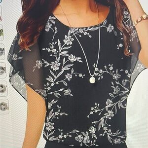 Nemesis women’s chiffon top - black with leaves